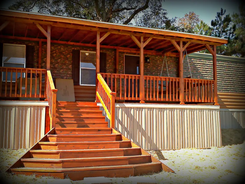 Cedar-stained covered porch with wide steps